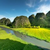 green field near mountains