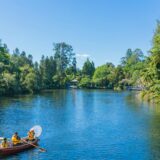 people using boat on body of water